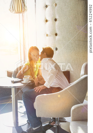 Portrait of Businessman sitting and whispering to 65224992