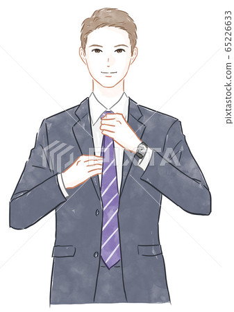 A man tying a tie 65226633
