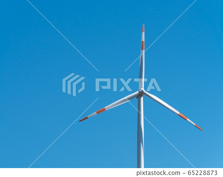Wind turbine with clear blue sky background. Wind turbine with clear blue sky background. 65228873