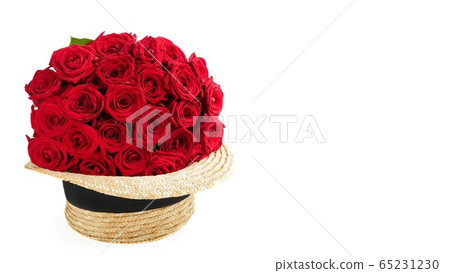 Luxury red roses in straw hat on white background. Luxury red roses in straw hat on white background. 65231230