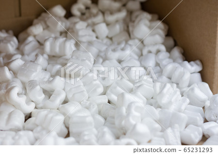 Red felt heart packaging box filled with many white styrofoam pellets. Red felt heart packaging box filled with many white styrofoam pellets. 65231293
