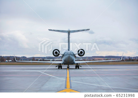 Rear view of airplane in airport Rear view of airplane in airport 65231998