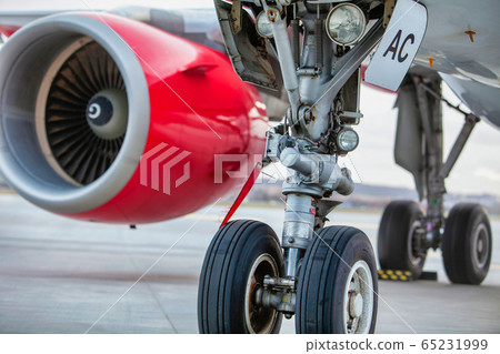 Close up of airplane engine in airport Close up of airplane engine in airport 65231999
