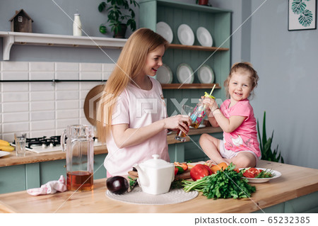 Happy woman making lunch from vegetables together 65232385