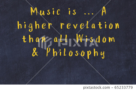 Chalk inscription of smart quote on black desk 65233779