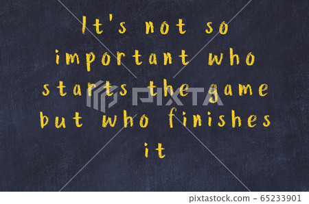 Chalk inscription of smart quote on black desk Chalk inscription of smart quote on black desk 65233901