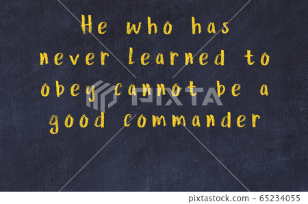 Black chalkboard with wise inscription on it 65234055