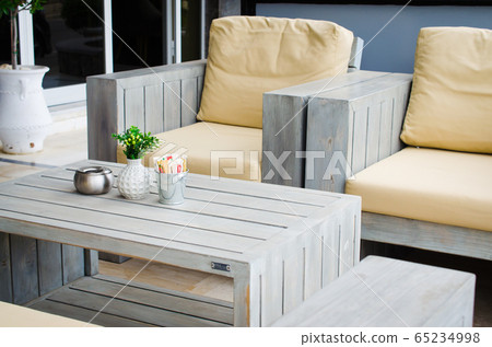 Cozy summer cafe. Tables and chairs on outdoor terrace. Empty street cafe or restaurant. Cozy summer cafe. Tables and chairs on outdoor terrace. Empty street cafe or restaurant. 65234998