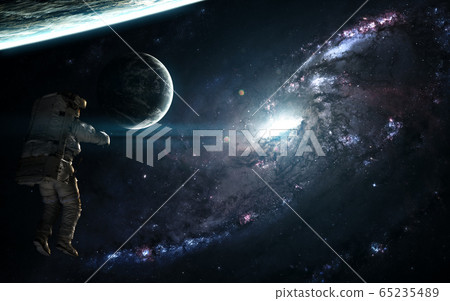 Blue galaxy, astronaut and exoplanets in deep space 65235489