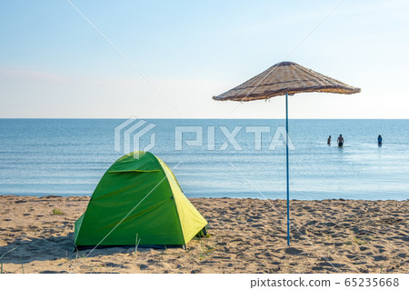 Camping tent on coast 65235668