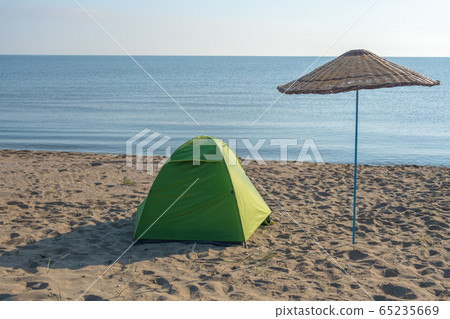 Camping tent on coast 65235669