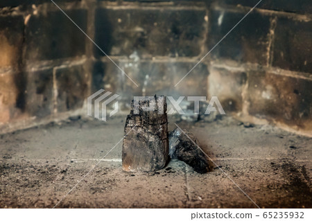 handful of black coals lay in the center of the 65235932