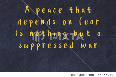 Chalk wise inscription on black chalkboard 65236959