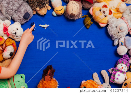 Lots of children's toys for child development games on a blue background Lots of children's toys for child development games on a blue background 65237244