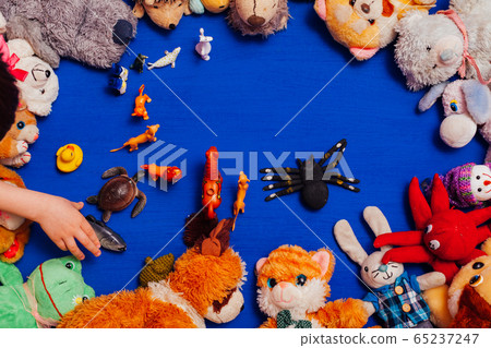 Lots of children's toys for child development games on a blue background Lots of children's toys for child development games on a blue background 65237247