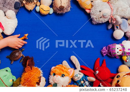 Lots of children's toys for child development games on a blue background Lots of children's toys for child development games on a blue background 65237248