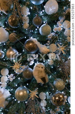 Close up of beautifully decorated Christmas ornament decorations in a Christmas tree Close up of beautifully decorated Christmas ornament decorations in a Christmas tree 65237863