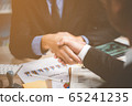 Two confident business man shaking hands 65241235