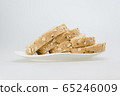whole wheat with oat bread sliced on white plate 65246009