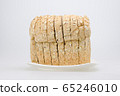 whole wheat with oat bread sliced on white plate 65246010