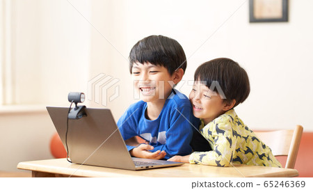 Boys having a video chat 65246369