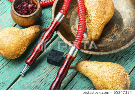 Smoking hookah with pear 65247354