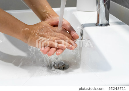 Washing hands rubbing with soap woman for corona 65248711