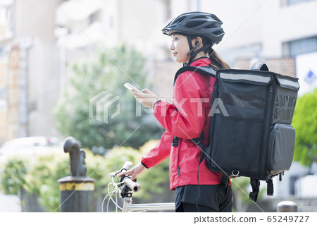 Female food delivery image 65249727