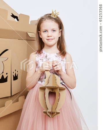 The princess play with cardboard castle tower. The princess play with cardboard castle tower. 65253568