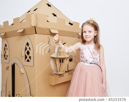 The princess play with cardboard castle tower. The princess play with cardboard castle tower. 65253570