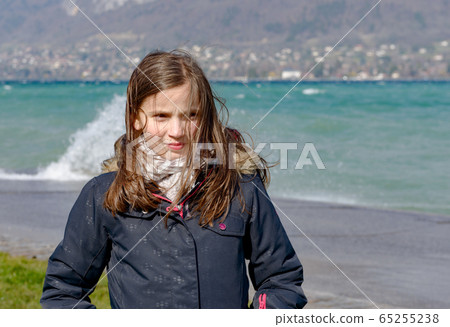preteen girl with hair in the wind 65255238