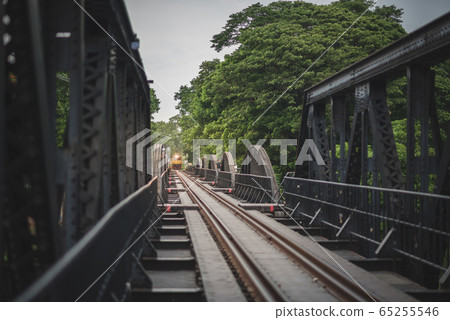 The scenery of the train is coming on the railway bridge across the Kwai River in Kanchanaburi 65255546