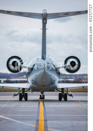 Rear view of airplane taking off in airport Rear view of airplane taking off in airport 65257727