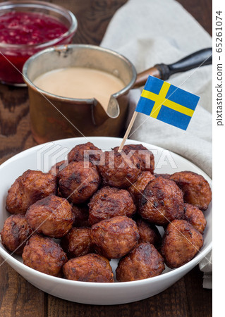 Meatballs served with cream sauce and cranberry Meatballs served with cream sauce and cranberry 65261074