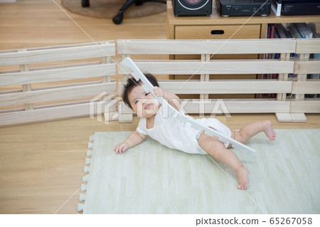 Mischievous baby 65267058