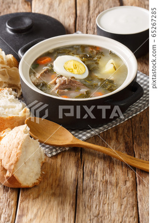 Hot light green borsch of sorrel, vegetables, eggs Hot light green borsch of sorrel, vegetables, eggs 65267285