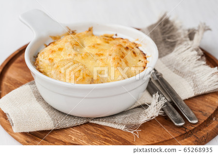 Potato gratin with herbs in batch form Potato gratin with herbs in batch form 65268935