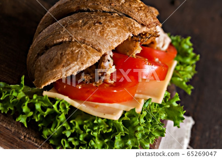grain croissant sandwich on a whiteboard and a dark background 65269047