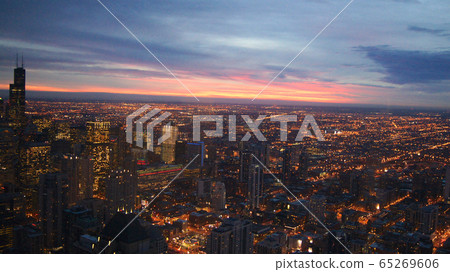 CHICAGO, ILLINOIS, UNITED STATES - DEC 11th, 2015: Aerial view of Chicago downtown at twilight from John Hancock skyscraper high above CHICAGO, ILLINOIS, UNITED STATES - DEC 11th, 2015: Aerial view of Chicago downtown at twilight from John Hancock skyscraper high above 65269606