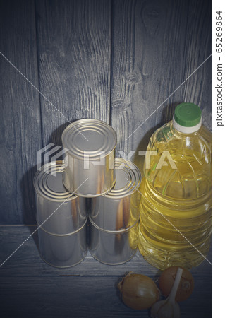 canned food on a wooden shelf, food crisis 65269864