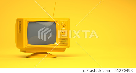 Yellow vintage tv set on yellow background. 65270498