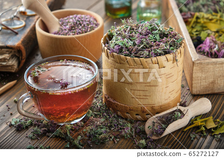 Cup of tea with wild Marjoram and Erica flowers. Cup of tea with wild Marjoram and Erica flowers. 65272127
