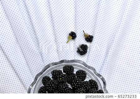 Half a round crystal vase with fresh blackberries Half a round crystal vase with fresh blackberries 65273233