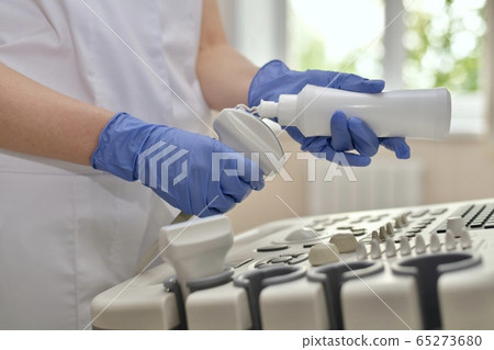 Hands with gloves starts squeezing out a little Hands with gloves starts squeezing out a little 65273680