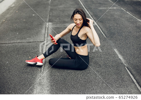 Sports girl training at the stadium Sports girl training at the stadium 65274926