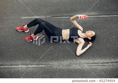 Sports girl training at the stadium Sports girl training at the stadium 65274954