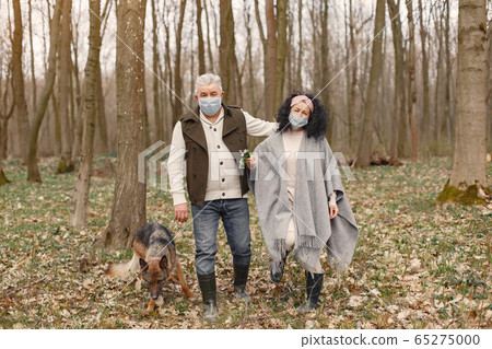 Elegant adult couple in a spring forest 65275000