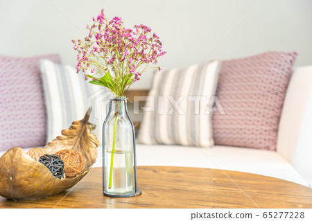 Flower vase on table with pillow on sofa decoration interior of living room Flower vase on table with pillow on sofa decoration interior of living room 65277228