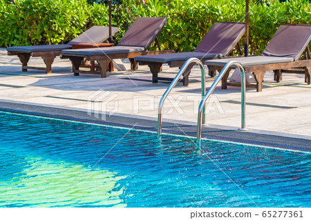 Stair around outdoor swimming pool in hotel resort 65277361