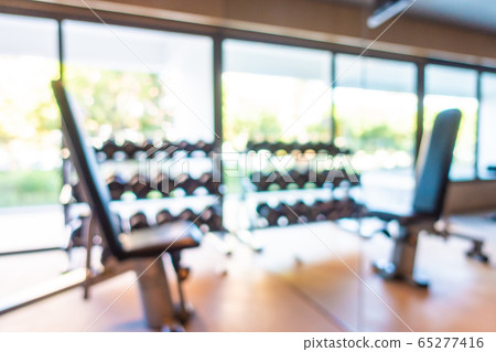 Abstract blur gym room interior with fitness equipment Abstract blur gym room interior with fitness equipment 65277416